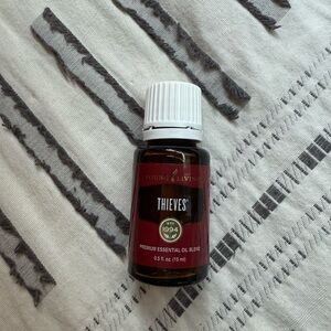 Young Living Thieves Oil in Red and White